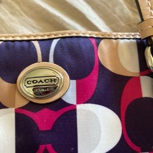 Small coach bag it has a few marks on it but could easily remove for 20 bucks. I